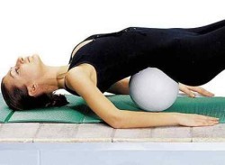 Exercise with a pillow under your lower back